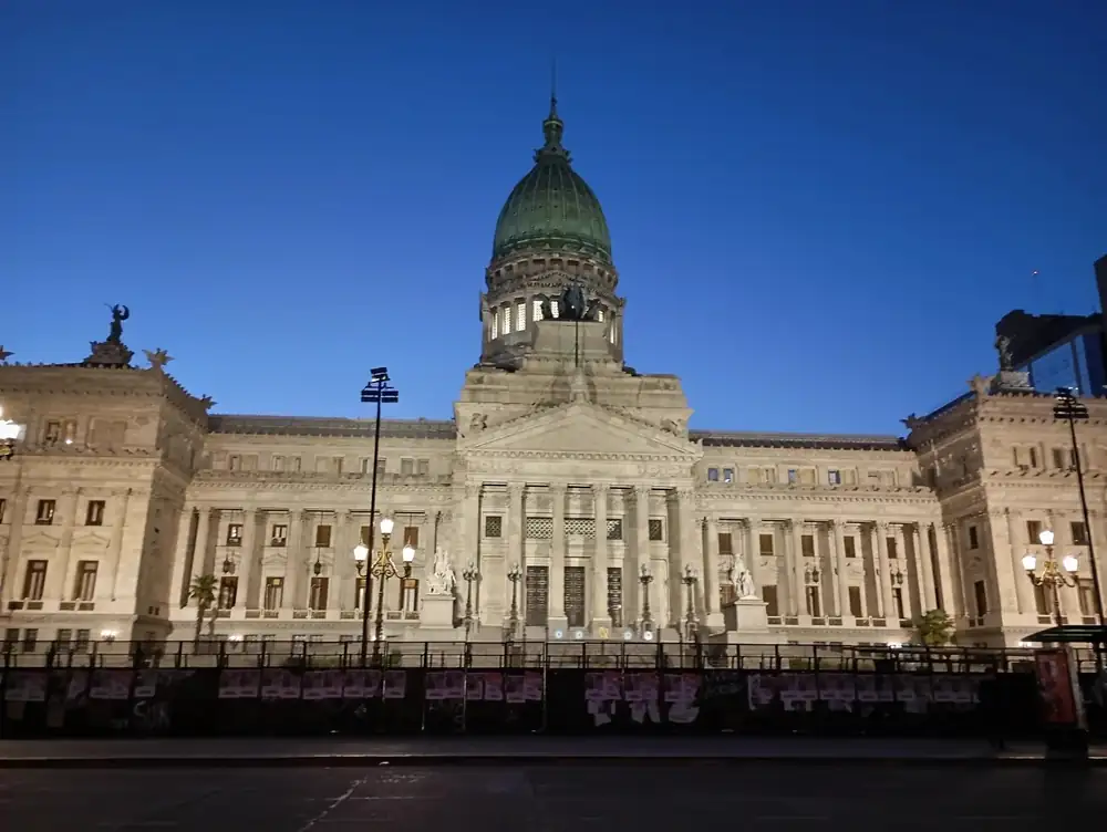 The Congreso building lit up at blue hour